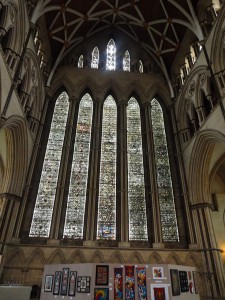 Medieval stained glass windows and an embroidery display based on motifs in the church