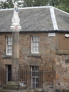 The Mercat (Market) Cross is old with the unicorn added in 1688
