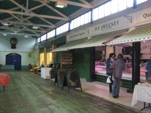 Rather slow day at the market. The butcher had some terrific chalk drawings on his sandwich boards. The market was looking a bit unloved.