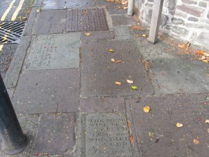 Tombstones in footpath below cathederal