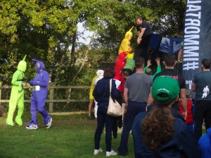 Teletubbies, a lamb and a sunflower were either waiting or in the process of passing the first obstacle 