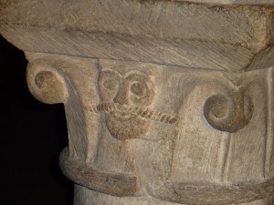 A very mustachioed face on one of the columns in the crypt