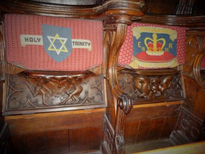 Some of the richly carved choir stalls with their embroidered cushions