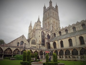 The cathedral from an internal square. The cloisters are the lowest sections of building on both sides of the lawn