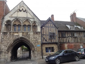 Ancient gate and part of a building. Same buildings as in previous photo. Bishop Hooper was burnt behind photographer during the reign of Queen Mary as he wouldn't change his religion. 
