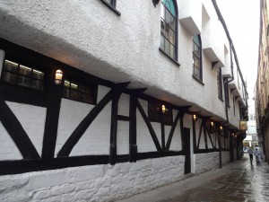 From the side alley with the walls showing the Tudor overhang