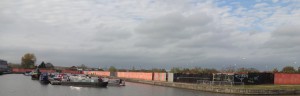 An arm of the canal containing moored narrow boats 