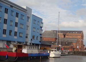 Old and new buildings and moored vessels
