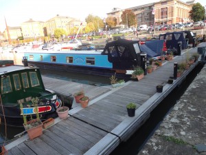 View back to Southgate St from another position and showing some of the narrow boats moored. The pot plants give them an air of permanency.